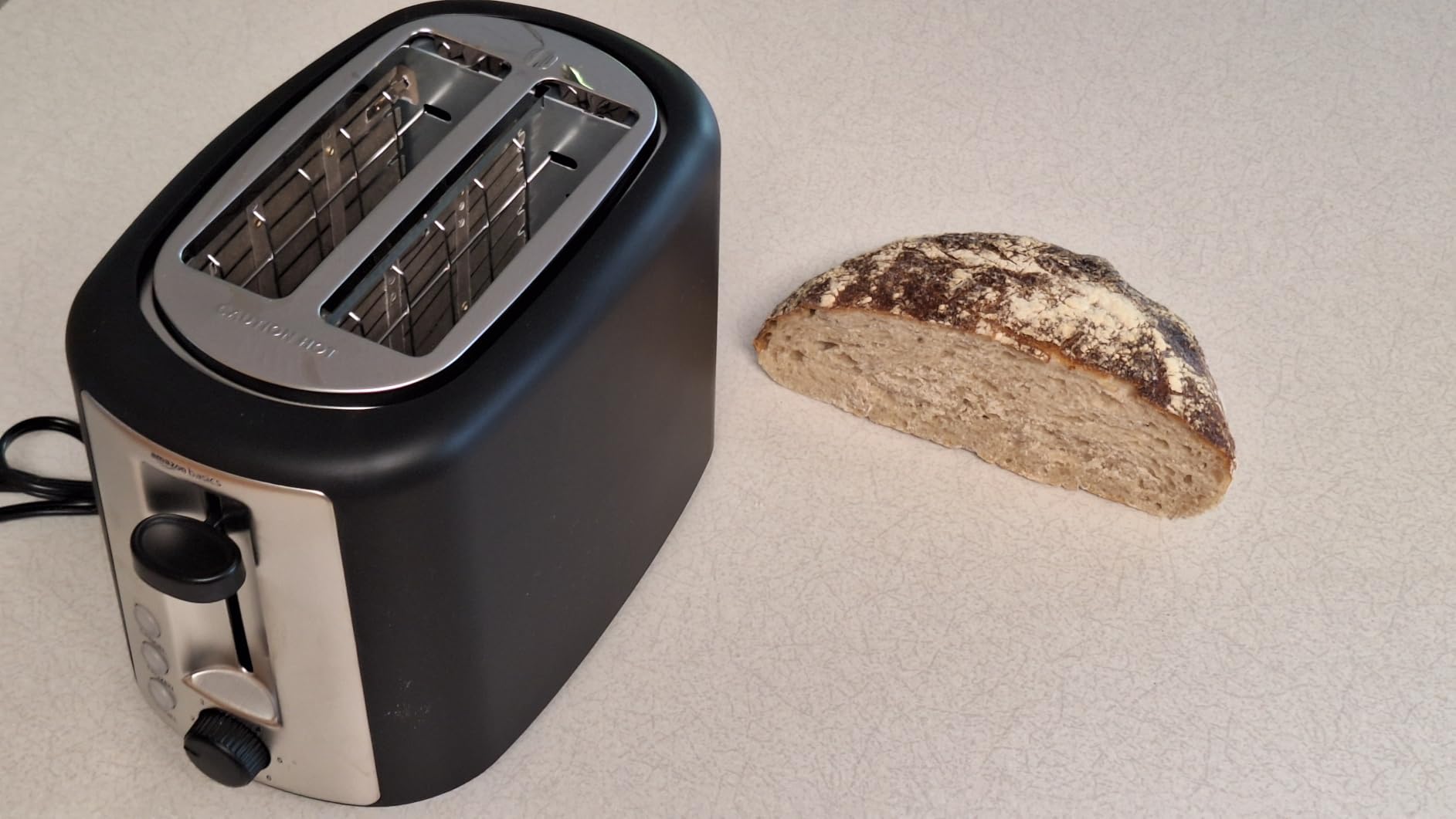 Amazon Basics 2 Slice Toaster, Extra Wide Slots for Bagels, 6 Browning Settings, Removable Crumb Tray, Defrost/Cancel/Bagel Buttons, Cord Wrap, 900W, Black & Silver customer photo 1